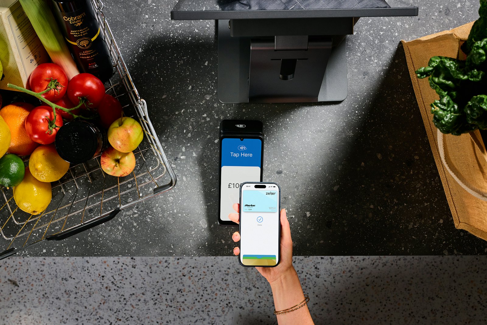 Paying with a phone at a checkout terminal